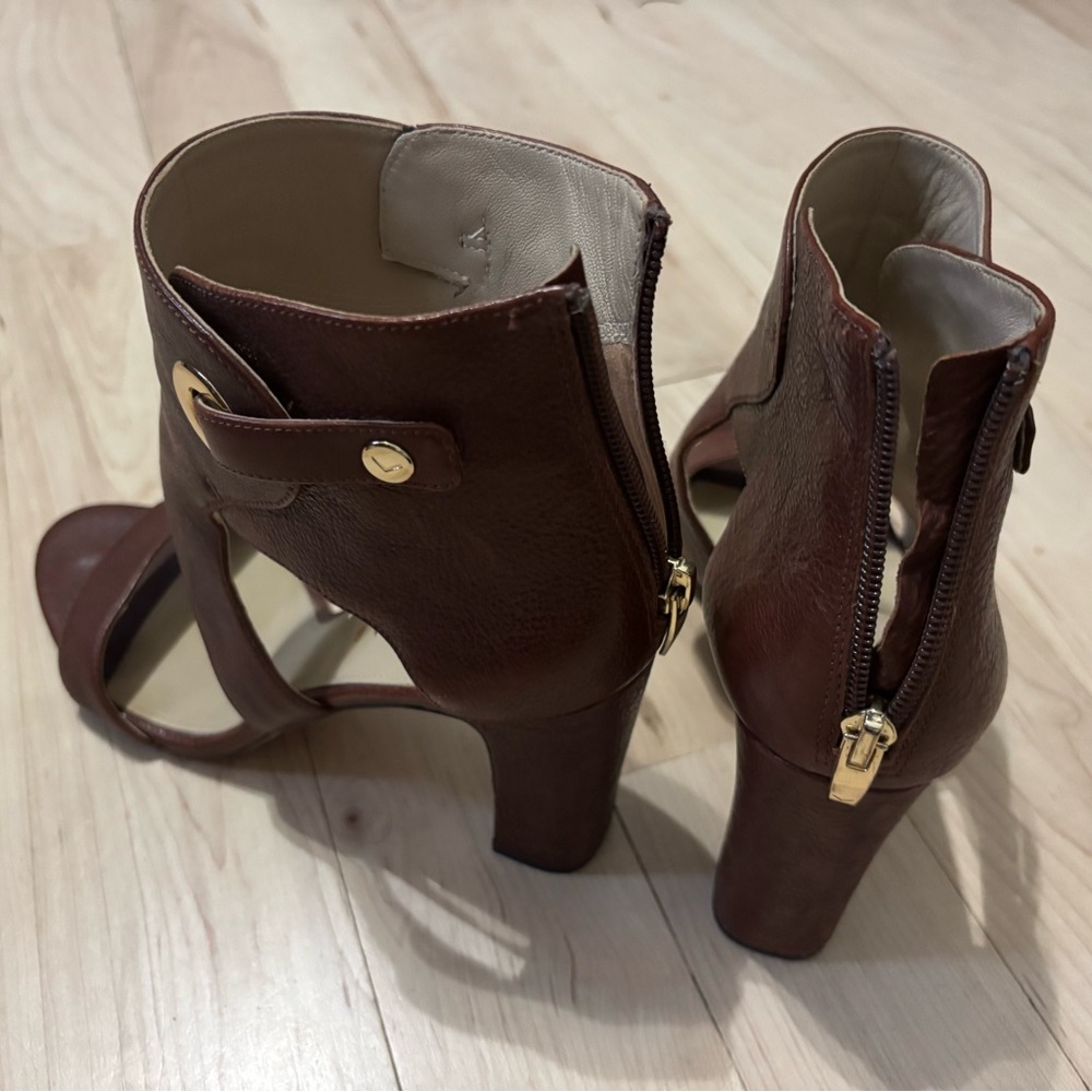 Gladiators style cognac leather sandals with 3” heel.